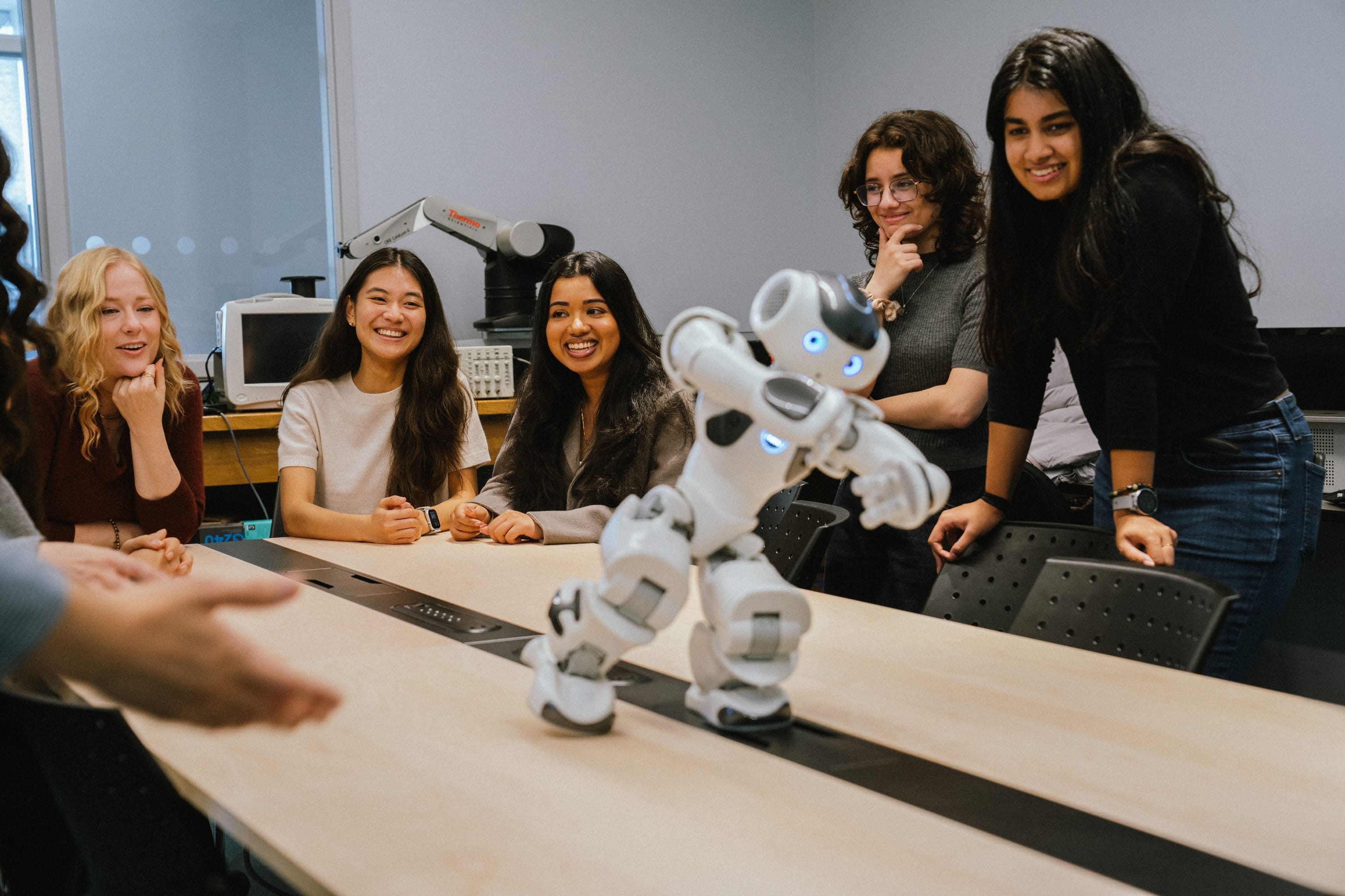 HURON lab members working with a robot