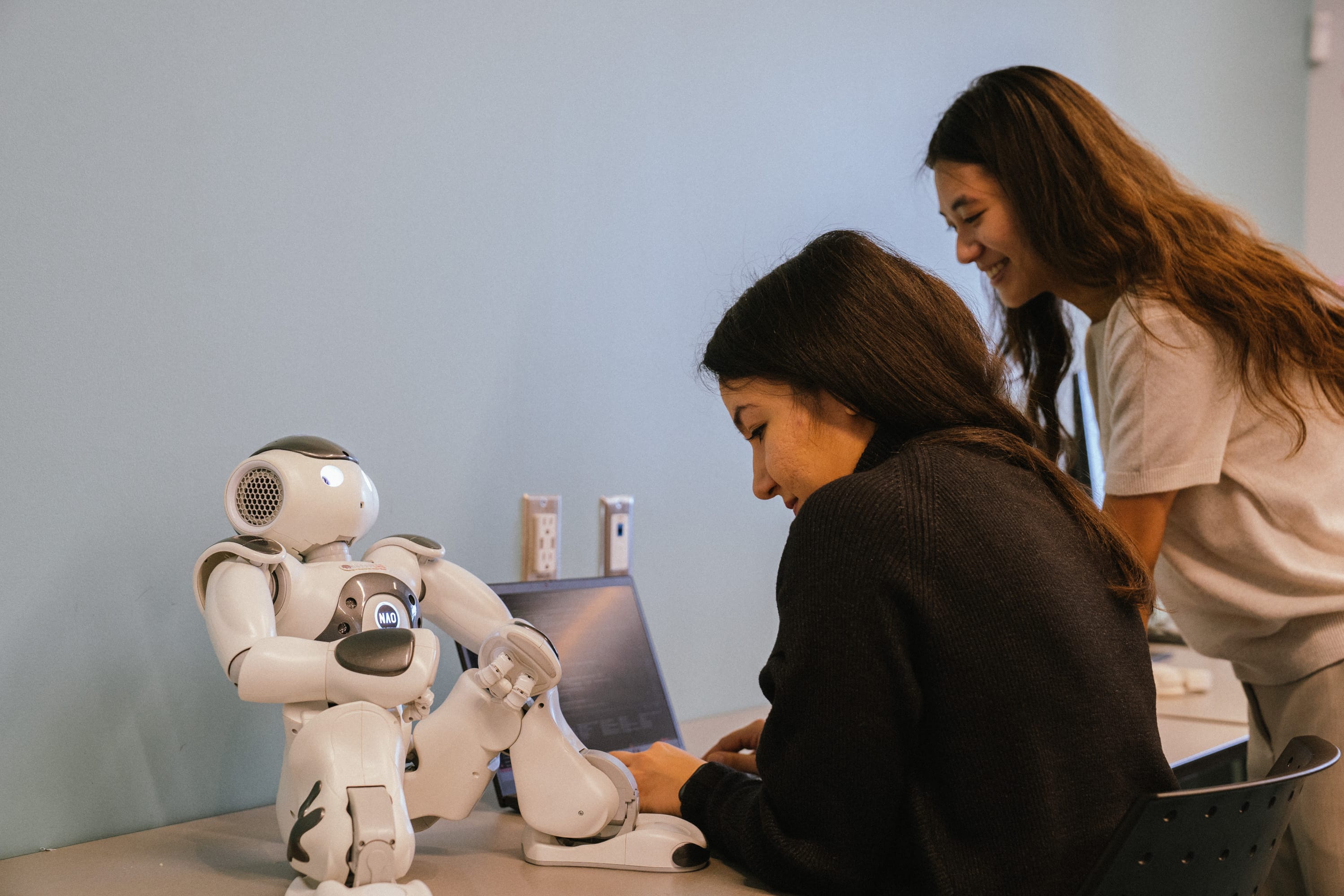 HURON lab members working with a robot