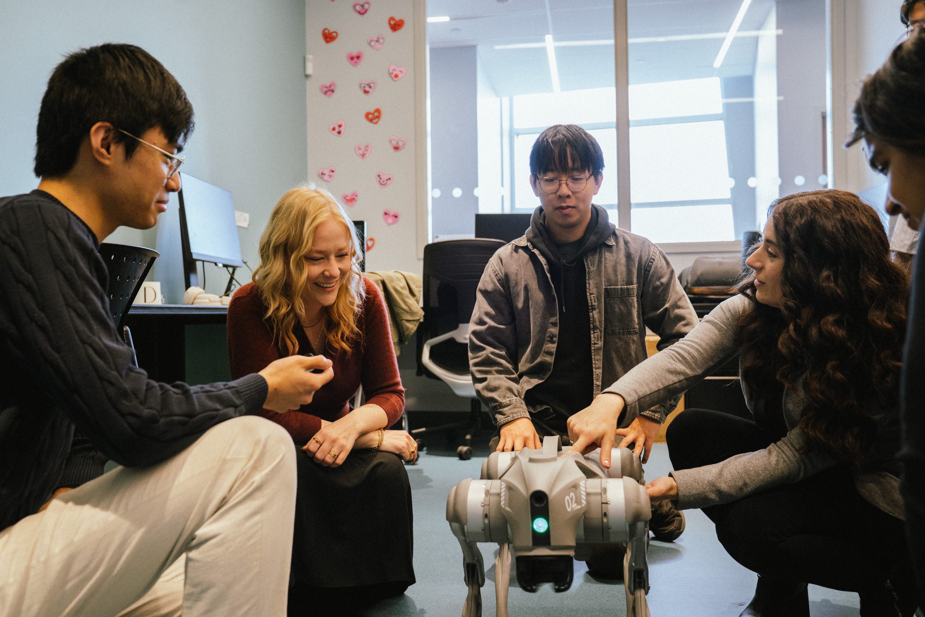 HURON lab members working with a robot